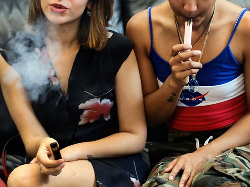 Two women vape at a party in Los Angeles. Last week, the Centers for Disease Control and Prevention in the US said more than three-quarters of the 805 confirmed and probable illnesses from vaping involved THC, the ingredient that produces a high in marijuana. 