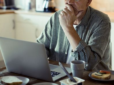 Man using laptop at home