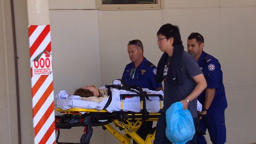 Two people were transferred by ambulance to John Hunter Hospital with spinal injuries. (9NEWS)