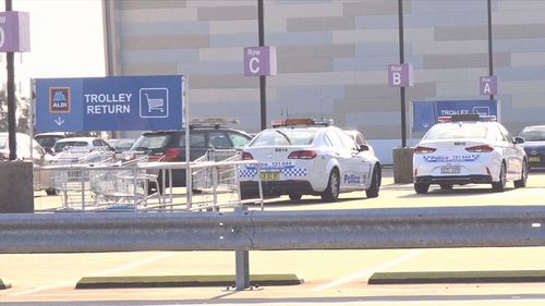 Police cars parked on the top level of Westfield Eastgardens where the carjacking took place.