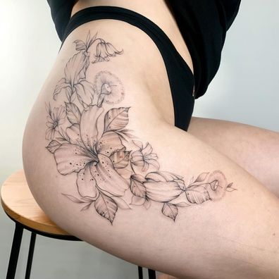 Large thigh tattoo by Claire Benson.