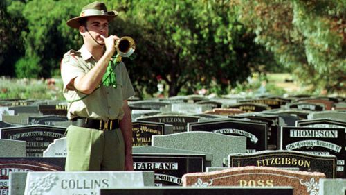 A lone bugler sounds the 'Last Post' at Centennial Park. (AAP)