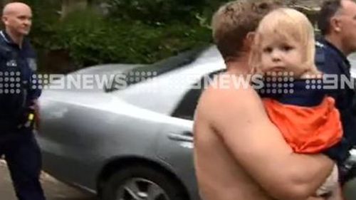 Dixie with her uncle after being rescued by police. (9NEWS)