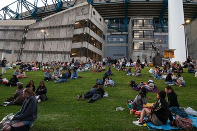 Taylor Swift fans, also known as "Swifties", with no tickets gather outside the Melbourne Cricket Ground on February 16, 2024 in Melbourne, Australia.