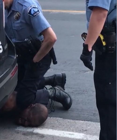 Officers were seen kneeling on the man's neck as he told them 'everything hurts'. 