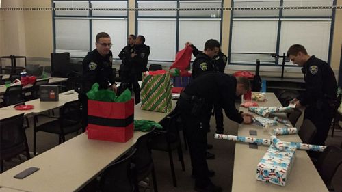 Officers wrap the gifts at the station. (Facebook: Fremont Police Department)