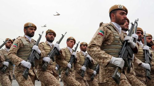 In this photo released by the official website of the office of the Iranian Presidency, troops march during the army parade commemorating National Army Day in front of the shrine of the late revolutionary founder Ayatollah Khomeini, just outside Tehran, Iran.