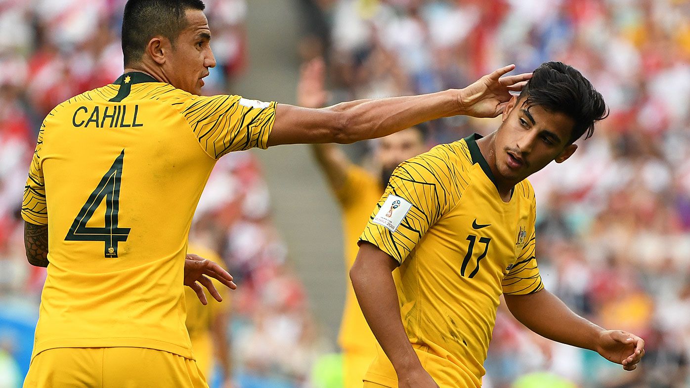 Australia's Tim Cahill and Daniel Arzani during their final FIFA World Cup group match against Peru