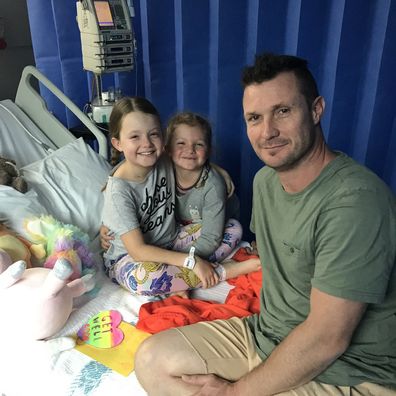 Charli Gerrey with her dad and little sister during cancer treatment.