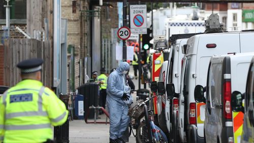 A forensic officer outside Parsons Green station in west London as a manhunt has been launched after a bomb was detonated in a terror attack on a packed London Underground train. (AAP)