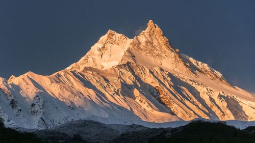 The sun rises over Manaslu, the 8163 meter peak in Nepal.