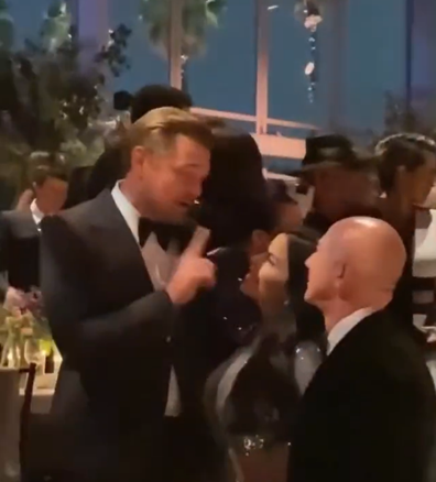 Leonardo DiCaprio speaking with Lauren Sanchez and Amazon billionaire Jeff Bezos