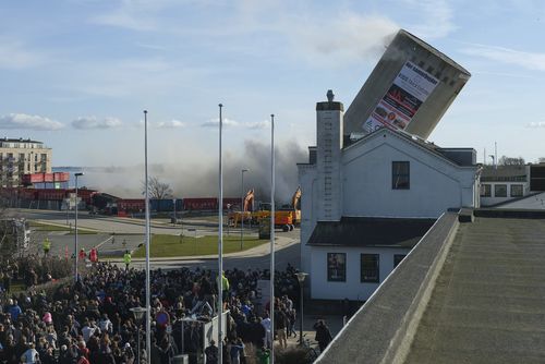 A silo demolition is seen after it fell in the wrong direction at Vordingborg Harbor in Denmark. (AAP)