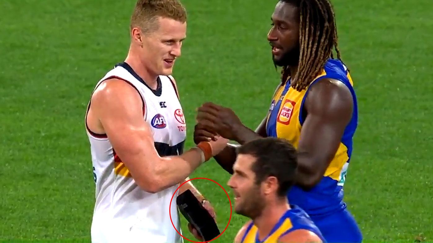 West Coast star Nic Naitanui gives Reilly O'Brien a new phone after mid-week twitter gaffe