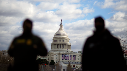 Law enforcement stand near the Capitol ahead of the inauguration of President-elect Joe Biden and Vice President-elect Kamala Harris, Sunday, Jan. 17, 2021, in Washington. (AP Photo/David Goldman)