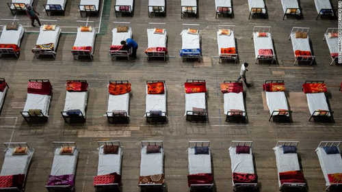 Workers prepared beds for a COVID-19 isolation centre that was set up inside a stadium in Srinagar on April 27. 