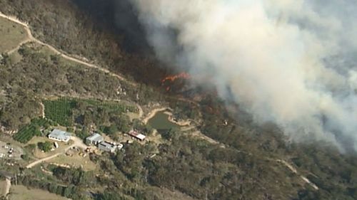 The small town of Ballandean on the QLD-NSW border is under threat from the fast-moving blaze. (9NEWS)