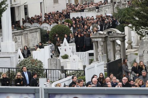 Relatives and friends of Liana Kalma Hananel gather to attend her funeral ceremony at the Ulus Sephardi Jewish Cemetery. (Getty)