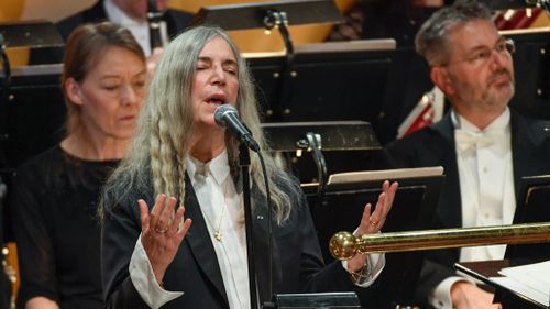 US singer Patti Smith performs 'A Hard Rain's A-Gonna Fall' by absent Literature prize winner Bob Dylan during the awardings of the Nobel Prizes in medicine, economics, physics and chemistry on December 10, 2016 in Stockholm, Sweden. (AFP)