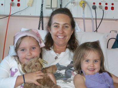 Sarah Lukeman in hospital with her daughters.