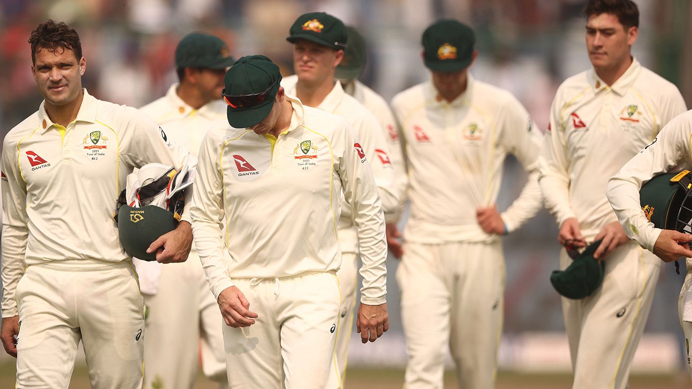 Australian players leave the field after being beaten in the second Test in Delhi.