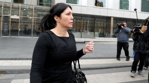 oberta Williams leaves the Victorian County courts after giving evidence in the on-going Coronial Enquiry into the murder of Victorian police informer Terrence Hodson and wife Christine in 2014. (AAP)