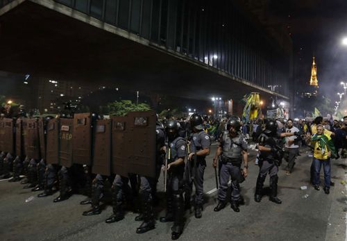 Riot police were out in support on the streets of Brazil's cities after Sunday's presidential election.