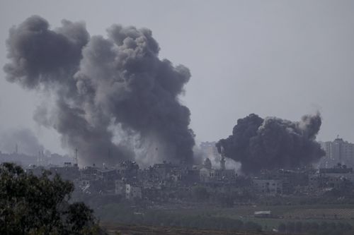 Smoke rises following an Israeli airstrike in the Gaza Strip, as seen from southern Israel, Saturday, Oct. 14, 2023.  