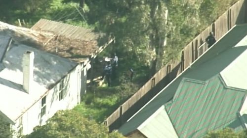 Man arrested after three-hour shed siege in Sydney’s south-west