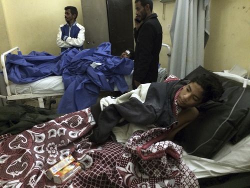 Abdallah Abdel Nasser, 14, receives medical treatment at Suez Canal University hospital in Ismailia, Egypt. (AAP)