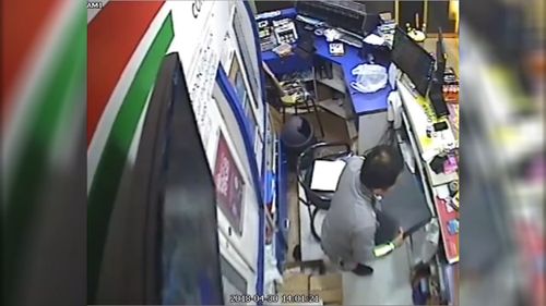 The thief notices the store is empty and first takes the till containing more than $800 (9NEWS)