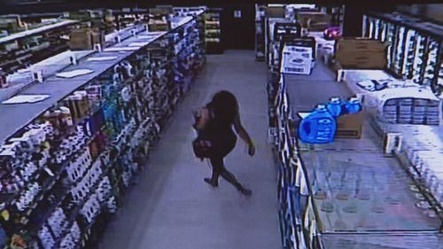 A woman has been shown on CCTV allegedly carrying out a stealing rampage in an Adelaide shopping precinct that later turned violent. CCTV exclusively obtained by 9News shows a woman taking items at an IGA on Flaxmill Road in Christie Downs while dancing in the aisles on Thursday.