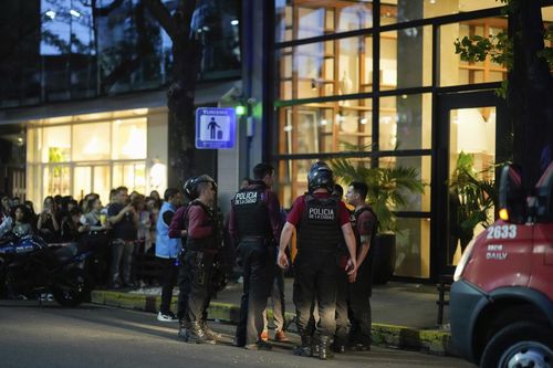 Police gather outside the hotel where Liam Payne, former member of One Direction, was found dead after falling from a balcony in Buenos Aires, Argentina, Wednesday, Oct. 16, 2024.