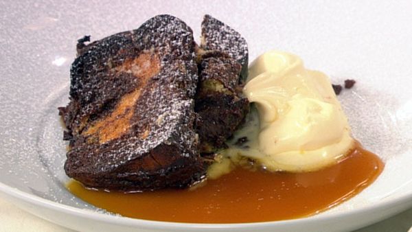 Baked french chocolate and brioche pudding with orange butterscotch toffee and double cream