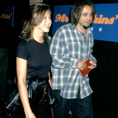 Jennifer Aniston and American musician Adam Duritz attend the "Mr. Jenkins Soiree" at the Ace Gallery Los Angeles on September 29, 1995 in Los Angeles, California.  