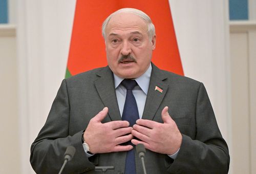 Belarusian President Alexander Lukashenko gestures during a joint news conference with Russian President Vladimir Putin following their talks in the Kremlin in Moscow, Russia, Friday, Feb. 18, 2022. (