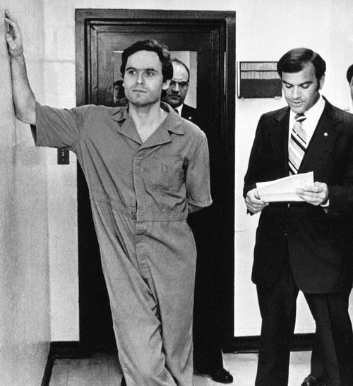 Theodore Bundy makes himself comfortable as Sheriff Ken Katsaris reads the indictment handed down by the Leon County Grand Jury, July 27, 1978 in Tallahassee, Florida.