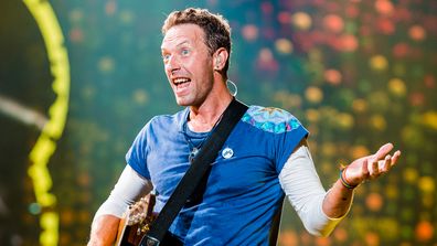 Chris Martin, performing, on stage