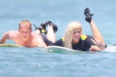 A month before the <i>Harper's</i> cover hit the stands, Gaga went surfing in Mexico... you guessed it, WITHOUT MAKEUP! But not without her trusty wig...