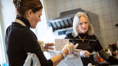 Sweden's Crown Princess Victoria volunteers to pack boxes at Stockholm City Mission foodbank