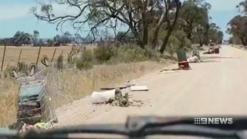 Truckloads of trash have been left strewn across the road near Lewiston, about 40 minutes from Adelaide.