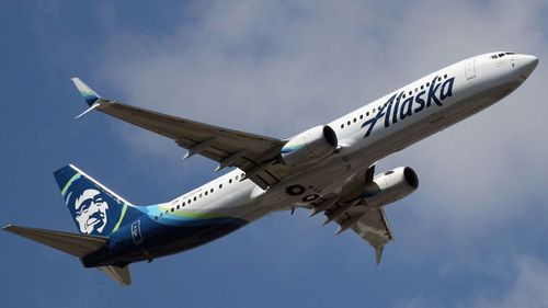 An Alaska Airlines passenger inside the cockpit attempted to seize control of the plane.