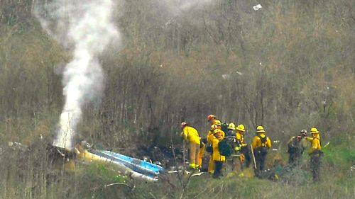 Firefighters and sheriffs work the scene of a helicopter crash that killed former NBA basketball player Kobe Bryant