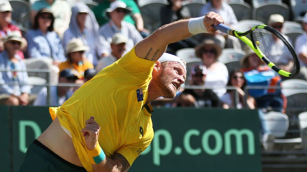 Sam Groth serving in Australia's doubles rubber against Slovakia.(AAP)