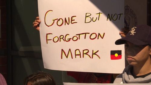 A sign held by family and friends outside Tamworth Police Station today. (9NEWS)