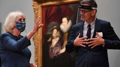  Camilla, Duchess of Cornwall speaks to National Gallery Head of Conservation Larry Keith as they look at the newly restored Equestrian Portrait of Charles I by Flemish artist Anthony Van Dyck during a visit to the recently reopened National Gallery on July 28, 2020 in London, England. 