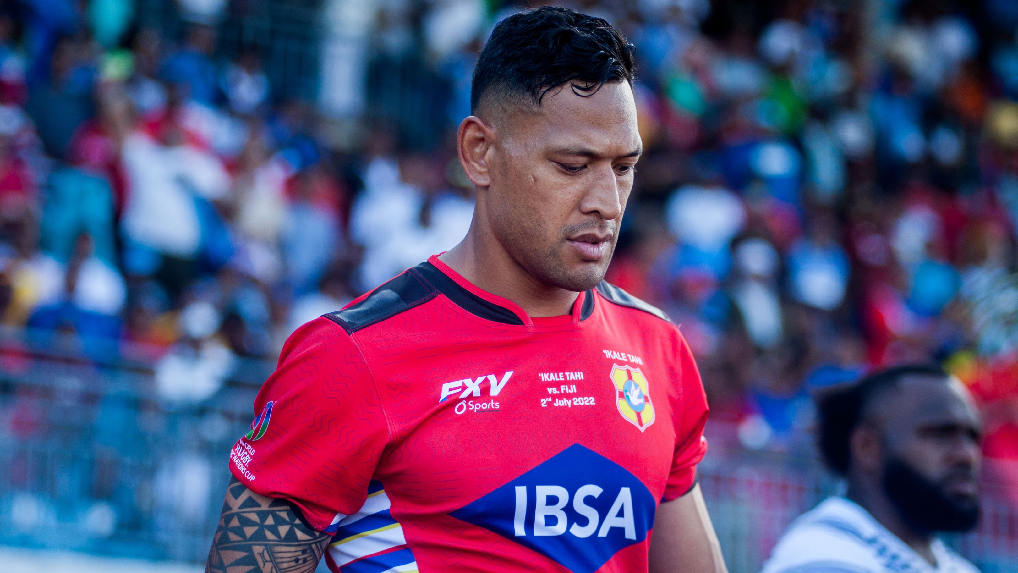 Israel Folau takes the field for Tonga in 2022.