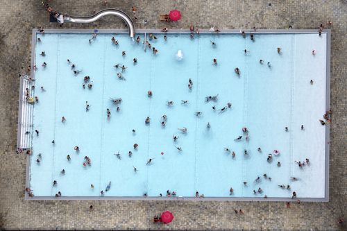 Visitors of a public pool are photographed from a small plane in Kleinmachnow, eastern Germany.