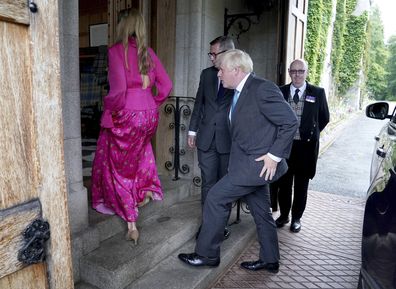 Outgoing Prime Minister Boris Johnson and his wife Carrie Johnson arrive at Balmoral for an audience with Britain's Queen Elizabeth II to formally resign as Prime Minister, in Aberdeenshire, Scotland, Tuesday, Sept. 6, 2022. (Andrew Milligan/Pool Photo via AP)