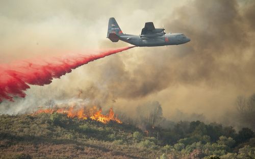 An international cavalcade has joined US firefighters to help tackle the blaze. Image: AAP